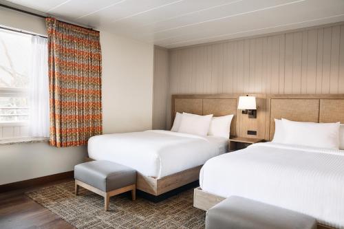 a hotel room with two beds and a window at Oglebay Resort in Wheeling