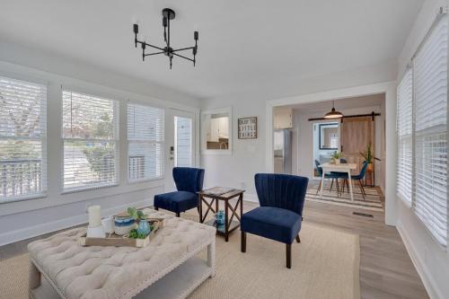 a living room with a couch and blue chairs at Cozy Fully-Renovated 2 BRM 2 Bath Near North Hills in Raleigh
