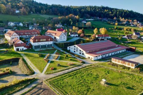 an aerial view of a small town with white buildings at Hotelový a jezdecký areál Dvůr Krutěnice in Krutěnice