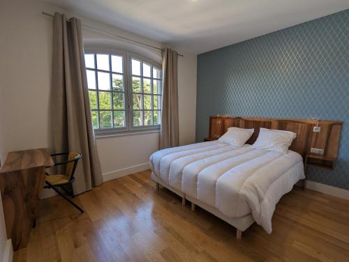 Postel nebo postele na pokoji v ubytování Maison Prunier