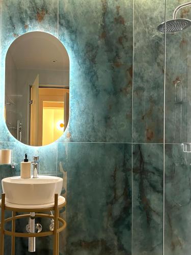 a bathroom with a sink and a mirror at Villa Stella in Gouvia