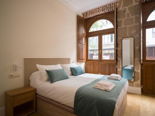 Ένα ή περισσότερα κρεβάτια σε δωμάτιο στο CASA MfT