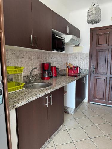 a kitchen with a sink and a counter top at Cabo Dream 73 in Cabo Negro
