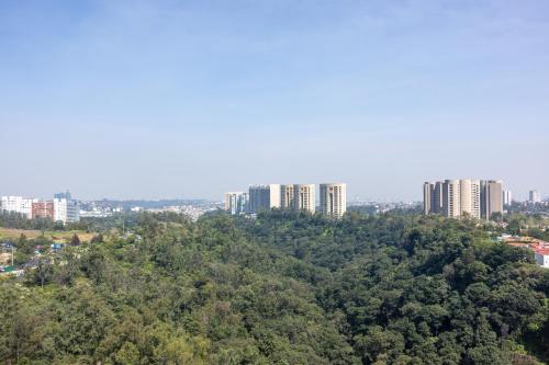 an aerial view of a city with tall buildings at The Westin Santa Fe, Mexico City in Mexico City