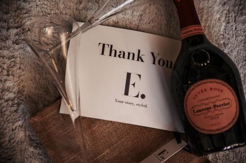 a bottle of wine with a thank you sign next to it at Annex at The Stables in the Heart of England in Hinckley