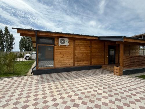 a small wooden building with a speaker on it at Cozy house 7 min walk from beach in Cholpon-Ata