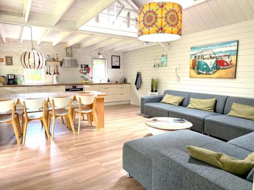 a living room with a couch and a table at Het Wierhuis in Pieterburen