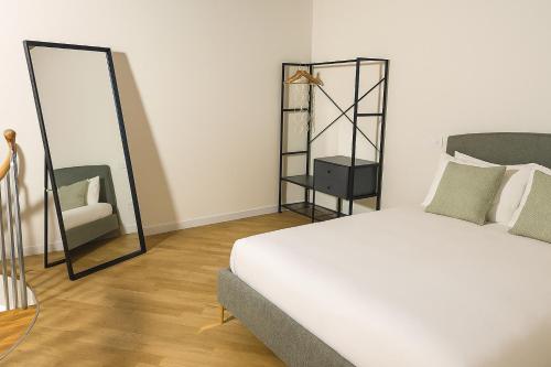 Postel nebo postele na pokoji v ubytování I BIMBI Apartments 'The Suite'