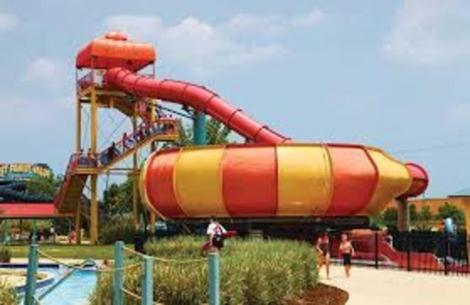 a water slide in a water park with people on it at Sands Ocean Club in Myrtle Beach