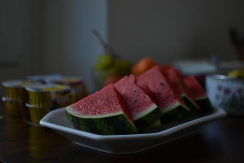a plate of watermelon slices on a table at Hotel Vienna in Pesaro