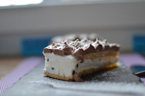 a piece of cake sitting on top of a table at Hotel Vienna in Pesaro