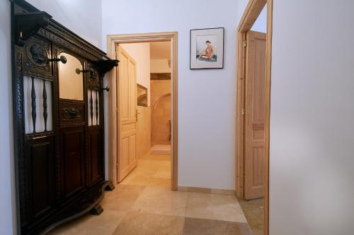 a hallway with a door leading into a room at Castell Granadella in L'Ampolla