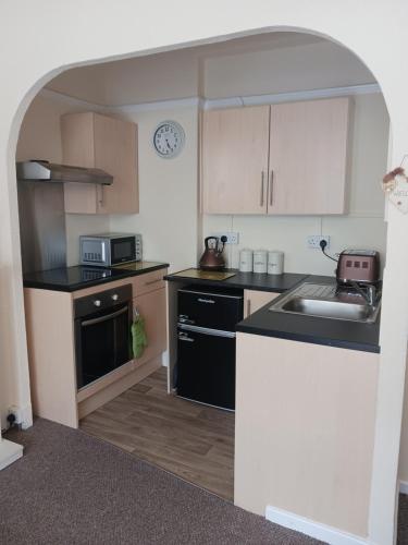 Nhà bếp/bếp nhỏ tại Beachcomber holiday apartments