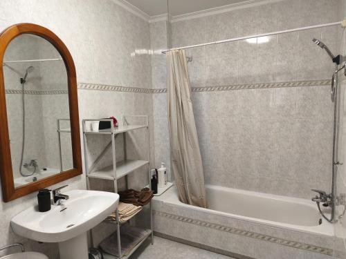 a bathroom with a sink and a tub and a shower at CA ÁNGEL in Anna