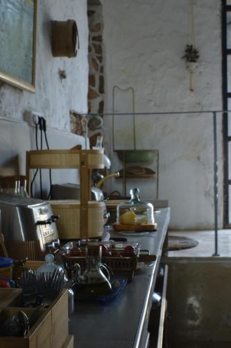 a kitchen with a counter top with dishes on it at Castell Granadella in L'Ampolla