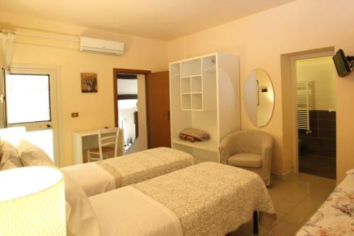 Postel nebo postele na pokoji v ubytování Agriturismo Peretti