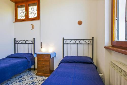 Ένα ή περισσότερα κρεβάτια σε δωμάτιο στο Casa Baita Flavia
