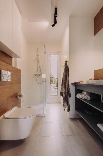 a bathroom with a white tub and a shower at BiałogóraChill 11A Całoroczne Spa i Active in Białogóra