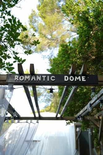 a sign that says romantic dance on top of a building at Logements insolites du Domaine de la Tuilière in Carnoules