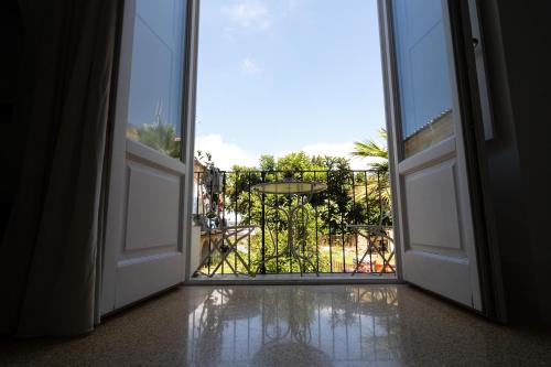 an open door with a view of a balcony at Antica Loggia in Vibo Valentia