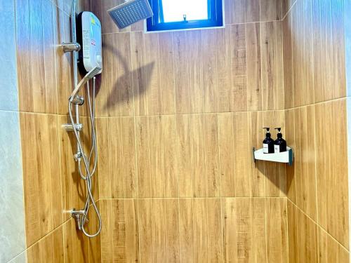 a shower in a bathroom with a shower at Home 2 bedroom Rayong long stay Phala Beach in Ban Chang
