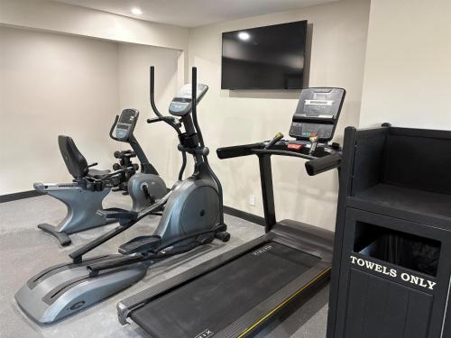 a gym with two exercise bikes and a television at Best Western San Diego Pacific Beach/Mission Bay in San Diego