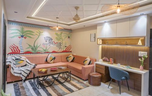 a living room with a couch and a table at Boutique Apartments By One Tree in Jodhpur