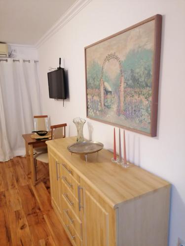 a living room with a painting on the wall at Apartments 135 in Vršac