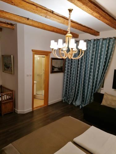 a living room with a chandelier at Apartments 135 in Vršac