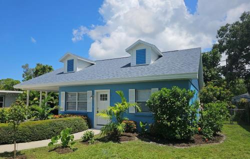 a blue house with a blue roof at Casa Playa in Sarasota