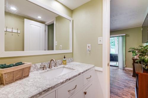 a bathroom with a sink and a mirror at Lovely lake view, Cozy Condo and Walden perks! in Montgomery