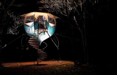 a structure with a flight of stairs in the dark at Logements insolites du Domaine de la Tuilière in Carnoules