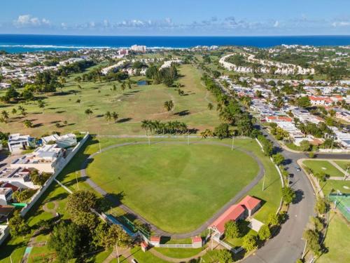 an aerial view of a park next to the ocean at 3 Bed 2 Bath A 8 Family House w Private Pool Dorado del Mar in Dorado