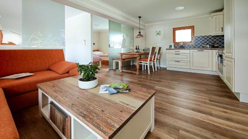 a living room with a couch and a table at Holiday Home Virida, app Leopold III in Ivančna Gorica