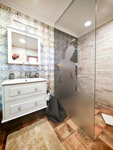 a bathroom with a sink and a shower at Holiday Home Virida, app Leopold III in Ivančna Gorica