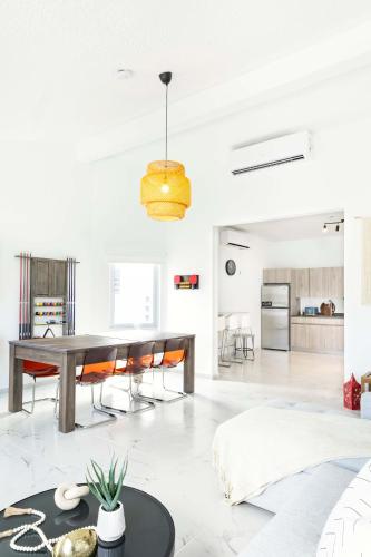 a dining room and living room with a table and chairs at 3 Bed 2 Bath A8 Family House w Private Pool Dorado del Mar in Dorado