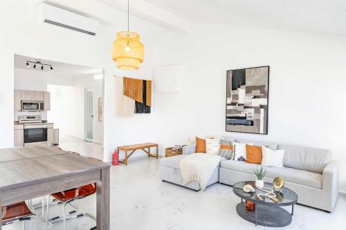 a living room with a couch and a table at 3 Bed 2 Bath A8 Family House w Private Pool Dorado del Mar in Dorado