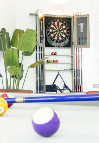 a dart board and balls on a table at 3 Bed 2 Bath A8 Family House w Private Pool Dorado del Mar in Dorado