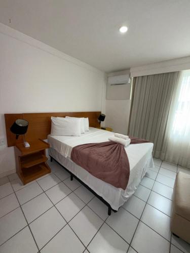 Ένα ή περισσότερα κρεβάτια σε δωμάτιο στο Aparthotel Orla de Ponta Negra RN