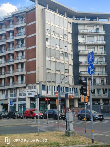 a large building with cars parked in front of it at ANGELICA Luxury in Bologna