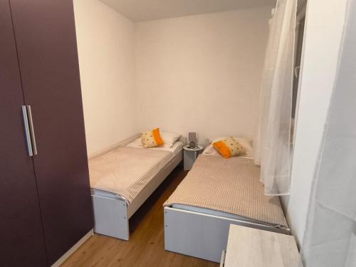 a small room with two beds in it at Villa Leen Dubrovnik in Ðurinići