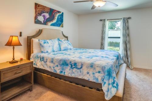 a bedroom with a bed and a window at Tavares Retreat with Covered Patio and Private Yard in Tavares