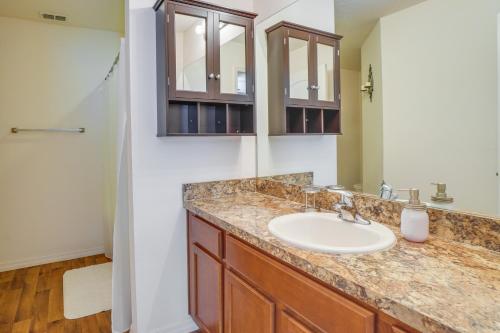 a bathroom with a sink and a mirror at Tavares Retreat with Covered Patio and Private Yard in Tavares