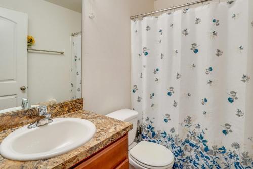 a bathroom with a sink and a toilet at Tavares Retreat with Covered Patio and Private Yard in Tavares