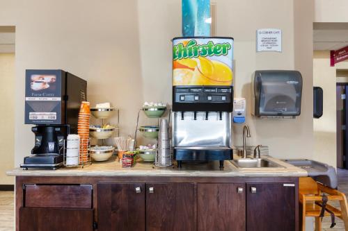a kitchen with a counter with a coffee maker at Quality Inn Columbia Mall in Grand Forks