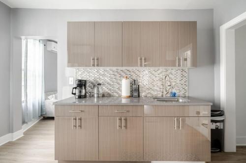 a kitchen with wooden cabinets and a counter top at 3 Bedrm Apt at Black Rock Suites in Bridgeport