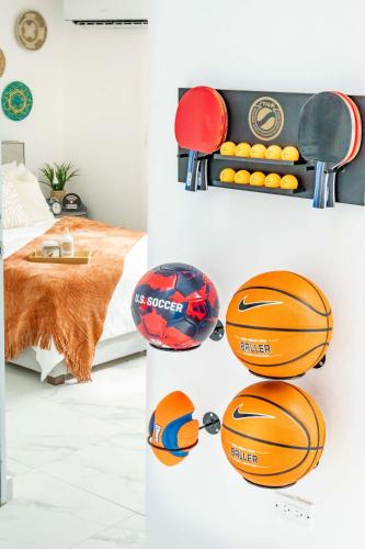 a room with basketballs and balls on the wall at 6 Bed 4 Bath Family Houses A8 w 2 Private Pools Dorado del Mar in Dorado