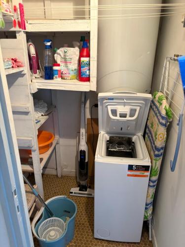 a kitchen with a stove and a refrigerator at Appartement vue mer in Binic-Etables-sur-Mer