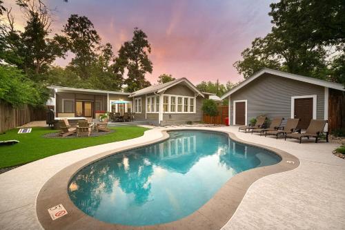 a swimming pool in the backyard of a house at Maverick's Manor - Hot tub Pool Fire Pit in Fredericksburg