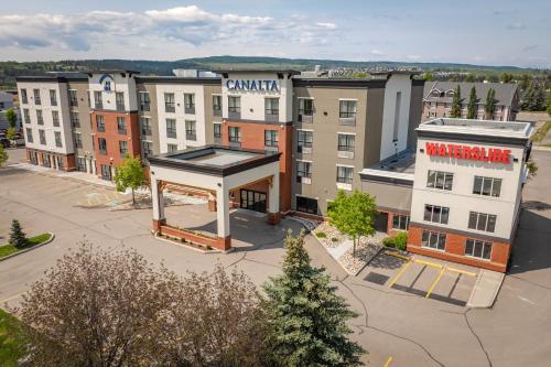 an overhead view of a city with a building at Canalta Cochrane in Cochrane
